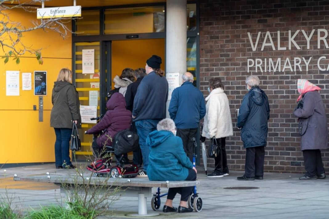 A queue of elderly people is seen outside Valkyrie Road Primary Care Centre in Westcliff on Sea, a borough of Southend, the NHS hidden waiting Crisis still continues.