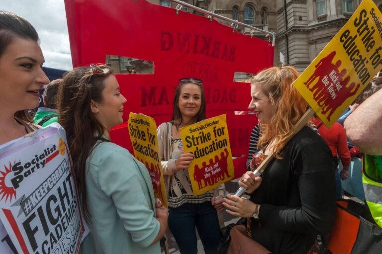 NUT members taking strike action against cuts in government funding and the increasing deregulation of teachers' pay and conditions